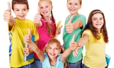 Group of teen school child with book thumb up.  Isolated.